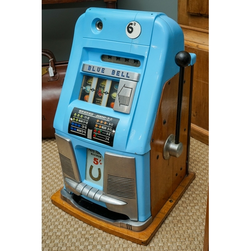 709 - Mill Blue Bell front slot machine ( one arm bandit), with key, working order, takes British 6D coins