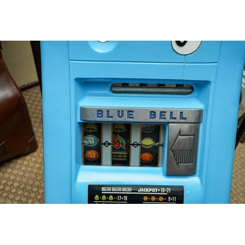 709 - Mill Blue Bell front slot machine ( one arm bandit), with key, working order, takes British 6D coins