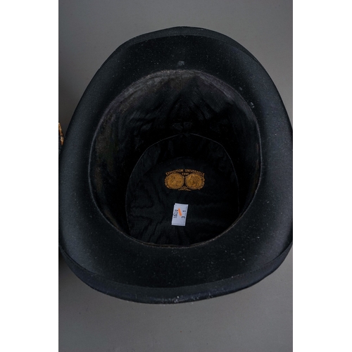 715 - An early 20th century French boxed black silk folding opera hat, the underside of the lid bears labe... 