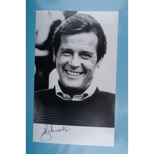 723 - Autographs, a folder of approximately one hundred signed photographs of actors from TV series and fi... 