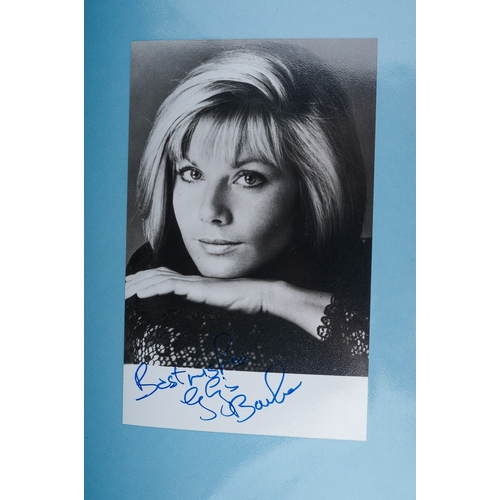 723 - Autographs, a folder of approximately one hundred signed photographs of actors from TV series and fi... 