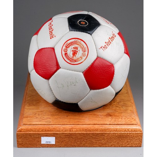 733 - A Manchester United Football Club Official Souvenir Football, bearing faded signatures including Gar... 