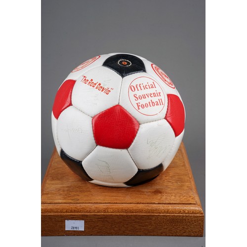 733 - A Manchester United Football Club Official Souvenir Football, bearing faded signatures including Gar... 