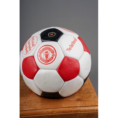 733 - A Manchester United Football Club Official Souvenir Football, bearing faded signatures including Gar... 