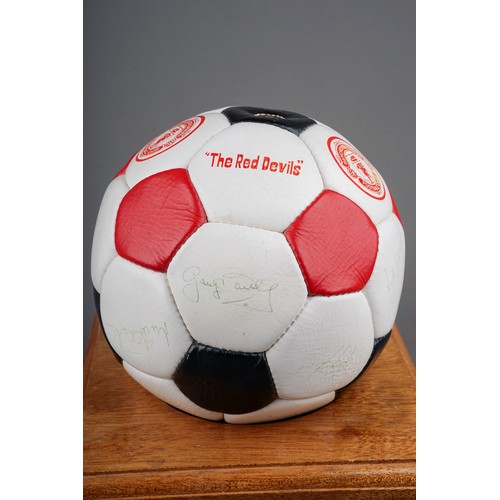 733 - A Manchester United Football Club Official Souvenir Football, bearing faded signatures including Gar... 