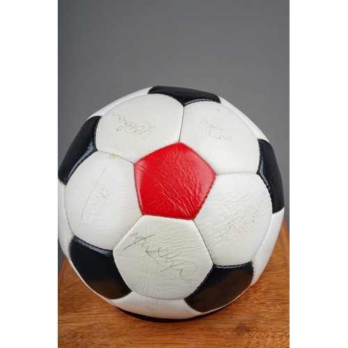 733 - A Manchester United Football Club Official Souvenir Football, bearing faded signatures including Gar... 