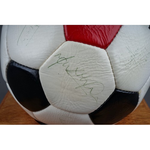 733 - A Manchester United Football Club Official Souvenir Football, bearing faded signatures including Gar... 