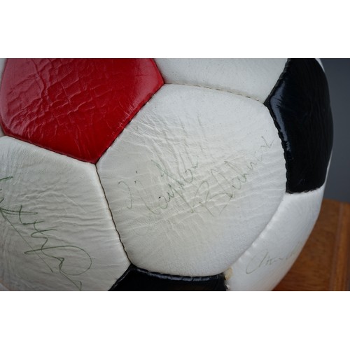 733 - A Manchester United Football Club Official Souvenir Football, bearing faded signatures including Gar... 