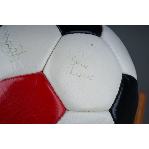 733 - A Manchester United Football Club Official Souvenir Football, bearing faded signatures including Gar... 