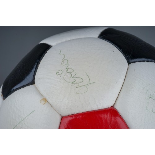 733 - A Manchester United Football Club Official Souvenir Football, bearing faded signatures including Gar... 