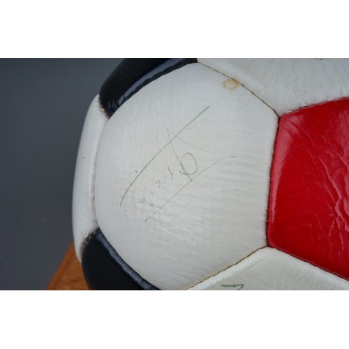 733 - A Manchester United Football Club Official Souvenir Football, bearing faded signatures including Gar... 