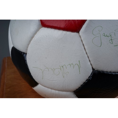 733 - A Manchester United Football Club Official Souvenir Football, bearing faded signatures including Gar... 