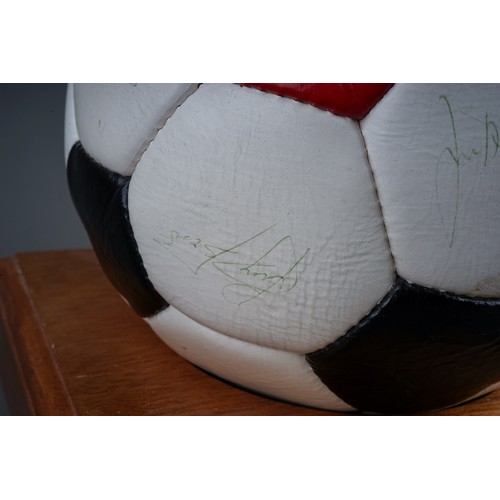 733 - A Manchester United Football Club Official Souvenir Football, bearing faded signatures including Gar... 