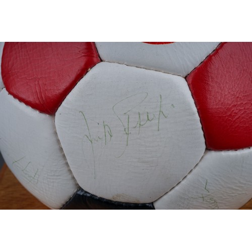 733 - A Manchester United Football Club Official Souvenir Football, bearing faded signatures including Gar... 