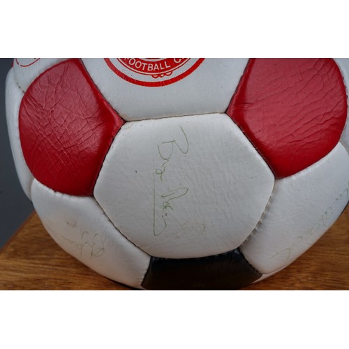 733 - A Manchester United Football Club Official Souvenir Football, bearing faded signatures including Gar... 