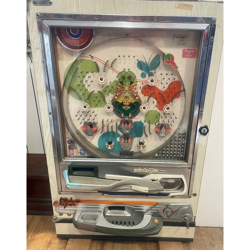 743 - A vintage Nishijin  Super Deluxe Japanese pachinko pin ball machine, measuring approx. 52 x 83 cm