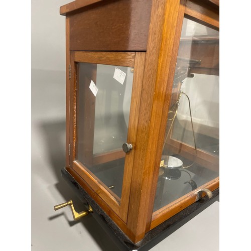 745 - A cased L Oertling of London Model 48 scientific balance scales, in wooden and glazed case, the case... 