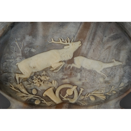 770 - A Victorian style marble effect resin desk tray, moulded with deer musical motifs and weapons amongs... 