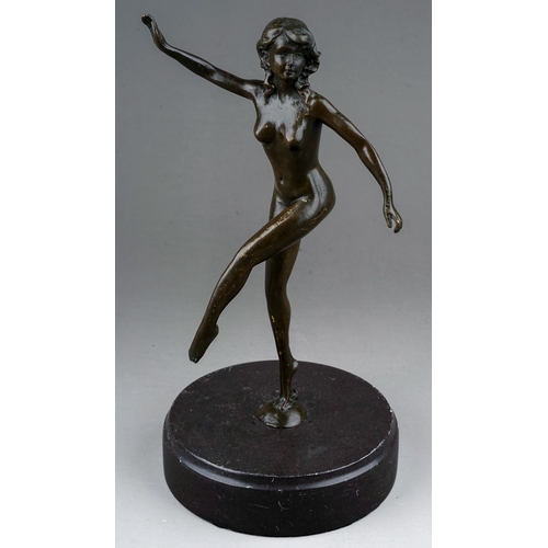 773 - A reproduction Art Deco style bronze of a female nude dancer, mounted on a circular black slate base... 