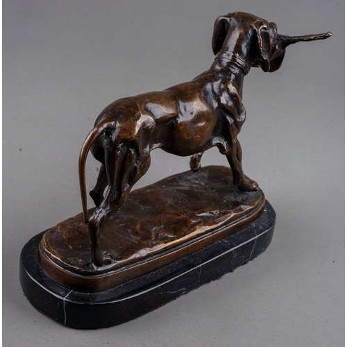 775 - A late 20th Century bronze figure of a gun dog carrying a pheasant in its mouth, unsigned, mounted o... 