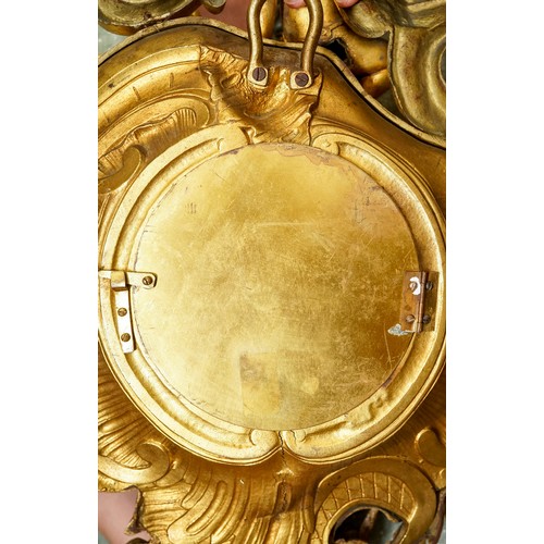 836 - A 19th century Marchand of Paris ormolu cartel clock, the Rococo style case cast with a putti sittin... 