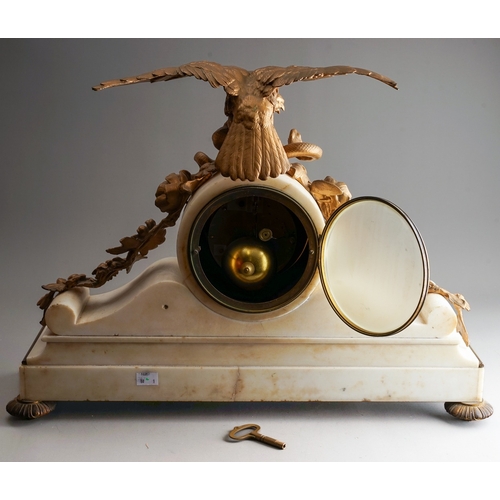 839 - A 19th Century French ormolu mounted marble clock, the drum head dial with volute scrolls supports a... 