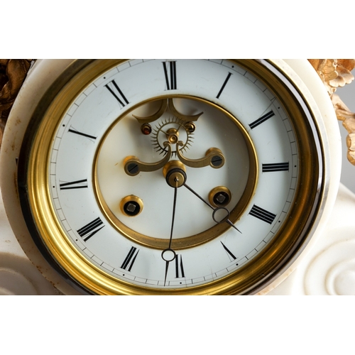 839 - A 19th Century French ormolu mounted marble clock, the drum head dial with volute scrolls supports a... 