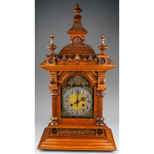 842 - A Continental mantle clock, with 8 day movement and coiled gong, in Architectural style walnut case ... 