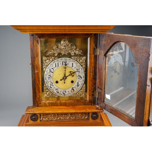 842 - A Continental mantle clock, with 8 day movement and coiled gong, in Architectural style walnut case ... 