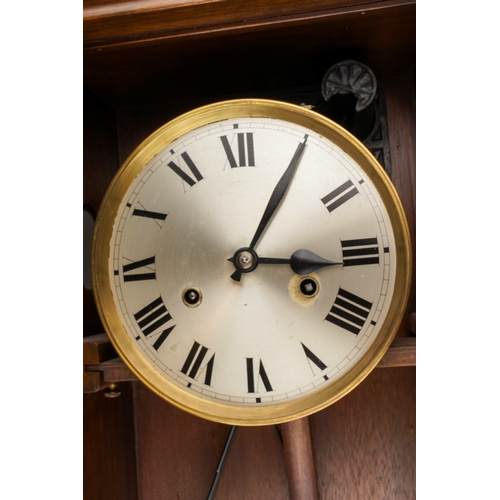 843 - An early 20th Century German mahogany cased H.A.C (Wurttemberg) wall clock with pendulum, glazed sin... 