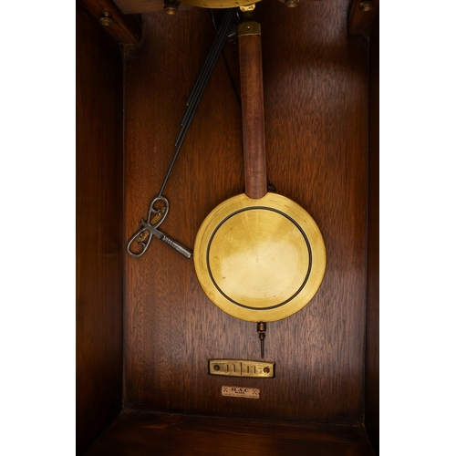 843 - An early 20th Century German mahogany cased H.A.C (Wurttemberg) wall clock with pendulum, glazed sin... 