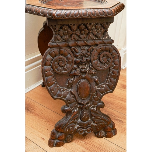 852 - A late 19th / early 20th century carved oak Italian Sgabello hall chair, profusely carved with carya... 