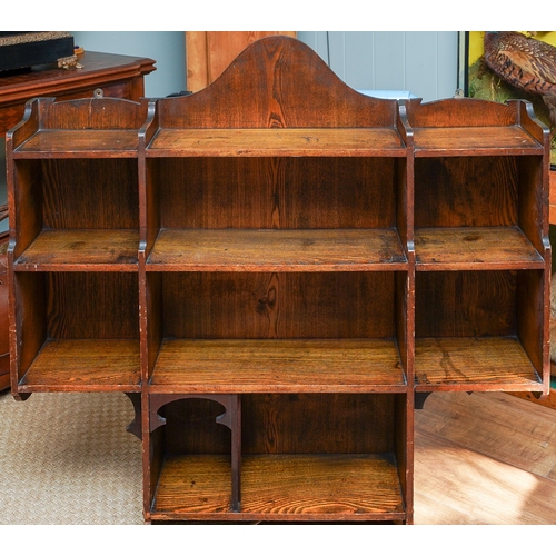 862 - A Liberty and Co Arts and Crafts oak open bookcase baring the original label to back. Measuring appr... 