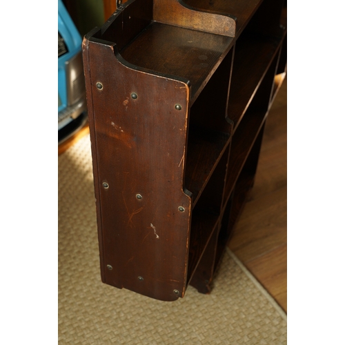 862 - A Liberty and Co Arts and Crafts oak open bookcase baring the original label to back. Measuring appr... 