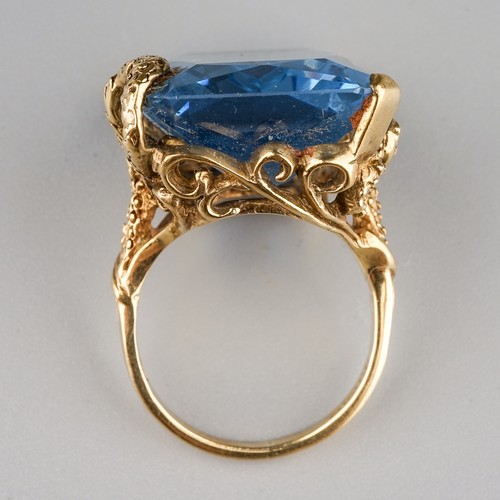 119 - A 9ct yellow gold and synthetic spinel dress ring, the large blue stone approx 25mm x 17mm x 9.9mm, ... 