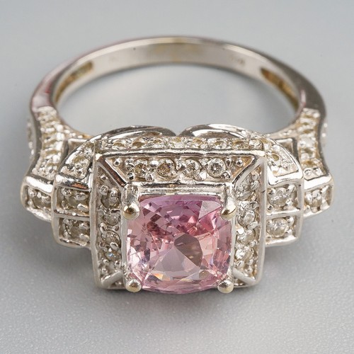 206 - A 14k white gold pink sapphire and diamond ring, set with a mixed-cut pink sapphire approx 7.6mm x 6... 