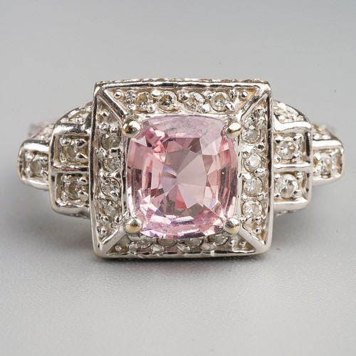 206 - A 14k white gold pink sapphire and diamond ring, set with a mixed-cut pink sapphire approx 7.6mm x 6... 