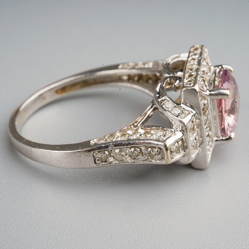 206 - A 14k white gold pink sapphire and diamond ring, set with a mixed-cut pink sapphire approx 7.6mm x 6... 