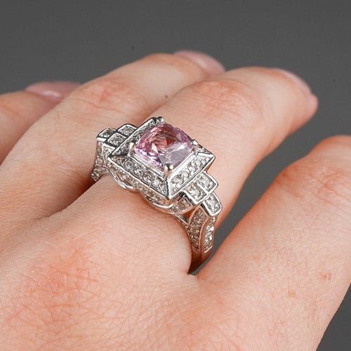 206 - A 14k white gold pink sapphire and diamond ring, set with a mixed-cut pink sapphire approx 7.6mm x 6... 