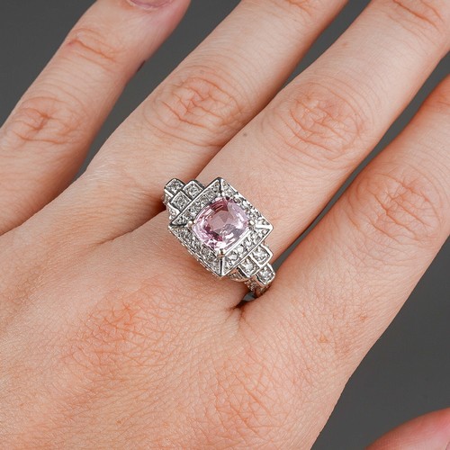 206 - A 14k white gold pink sapphire and diamond ring, set with a mixed-cut pink sapphire approx 7.6mm x 6... 