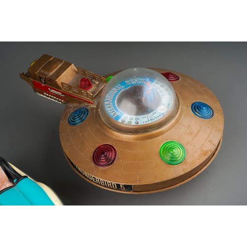 636 - A JR 21 Toy, Thunderbird 5, battery operated space monitor with flashing lights together with two no... 