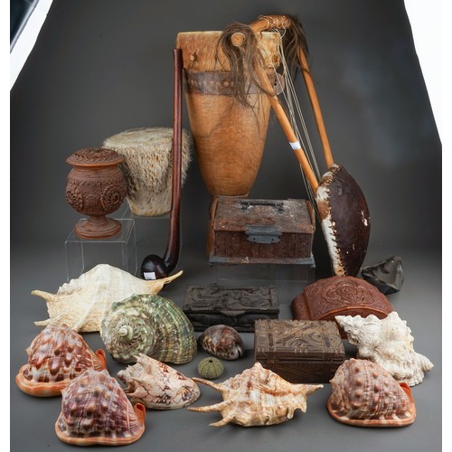 721 - A box containing a collection of curios and collectables, including a late 19th century African war ... 