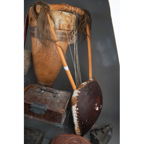 721 - A box containing a collection of curios and collectables, including a late 19th century African war ... 