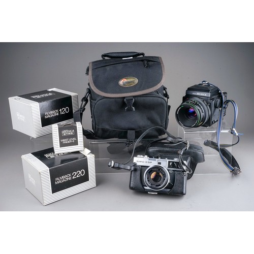 664 - A zenza Bronica ETRS medium format camera with a zenzanon 75mm f/2.8 lens along with two film back m... 