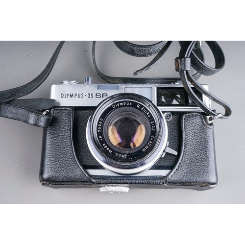 664 - A zenza Bronica ETRS medium format camera with a zenzanon 75mm f/2.8 lens along with two film back m... 