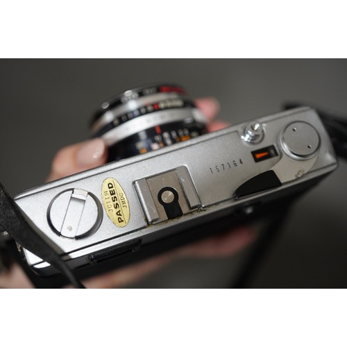 664 - A zenza Bronica ETRS medium format camera with a zenzanon 75mm f/2.8 lens along with two film back m... 