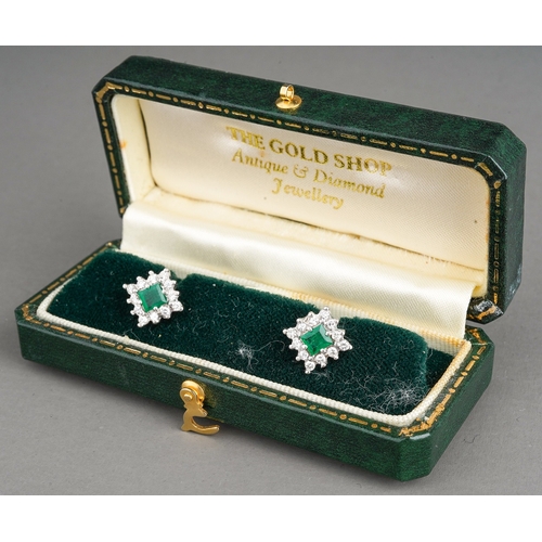 13 - A pair of 18ct gold emerald and diamond square cluster earrings, set with a rectangular emerald with... 