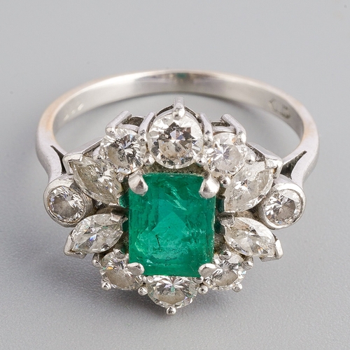 15 - A platinum emerald and diamond cluster ring, set with an emerald-cut emerald approx 7.00mm x 5.35mm ... 