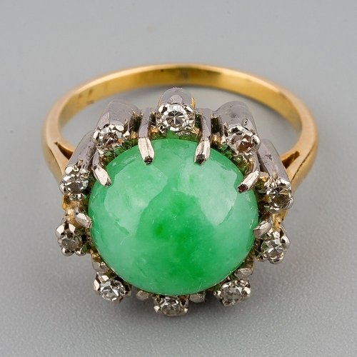 29 - A jade and diamond cluster ring, set with a jadeite cabochon and single cut diamonds, ring unmarked,... 