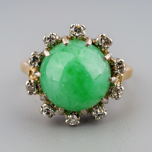 29 - A jade and diamond cluster ring, set with a jadeite cabochon and single cut diamonds, ring unmarked,... 